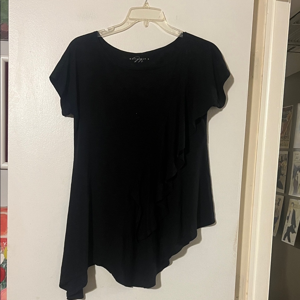Matthildur black cap sleeve top. Ruffle detail. Handkerchief hem
